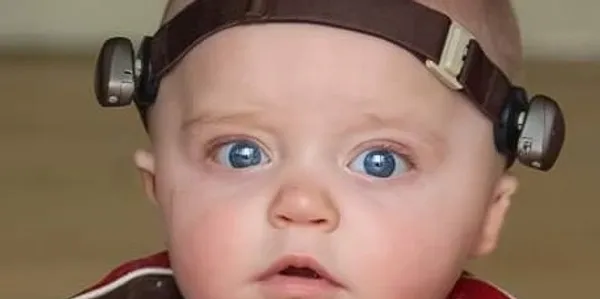 Baby wearing bone conduction device headband